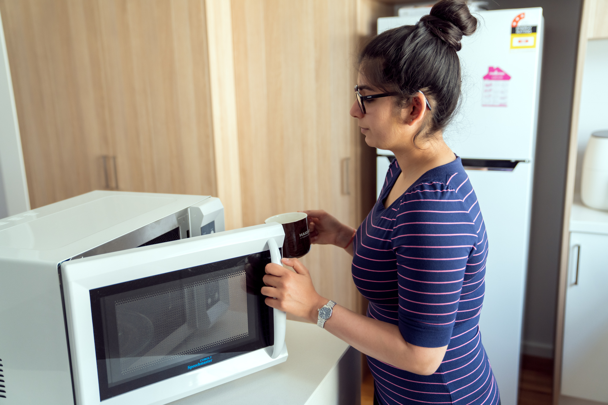 Anushka opening her talking microwave.