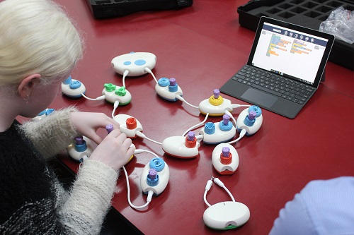 A young girl uses Code Jumper