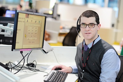 Image shows VA client Paul sitting at his desk