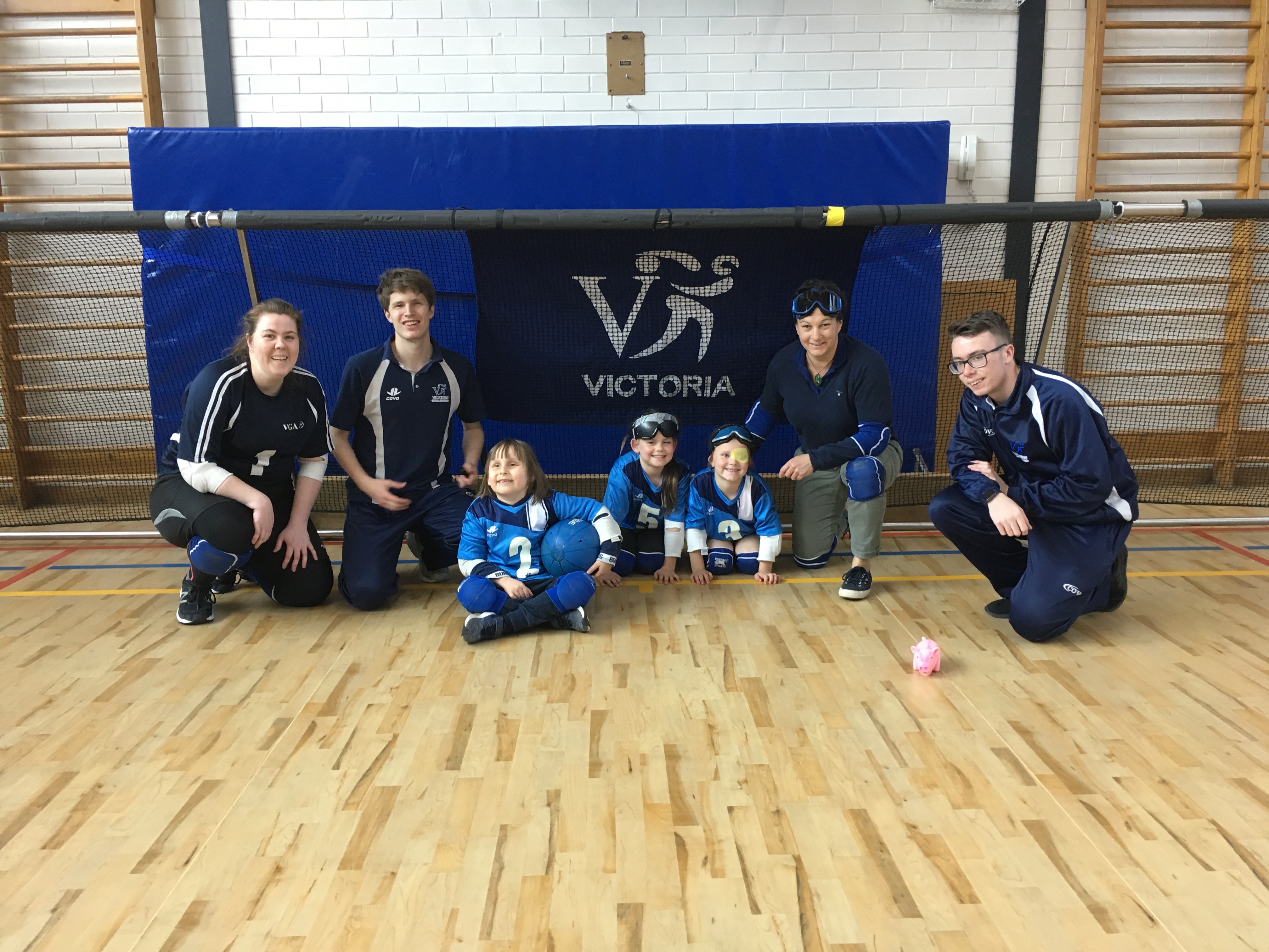 Staff and kids pose for a photo at Scotch College's indoor sports hall