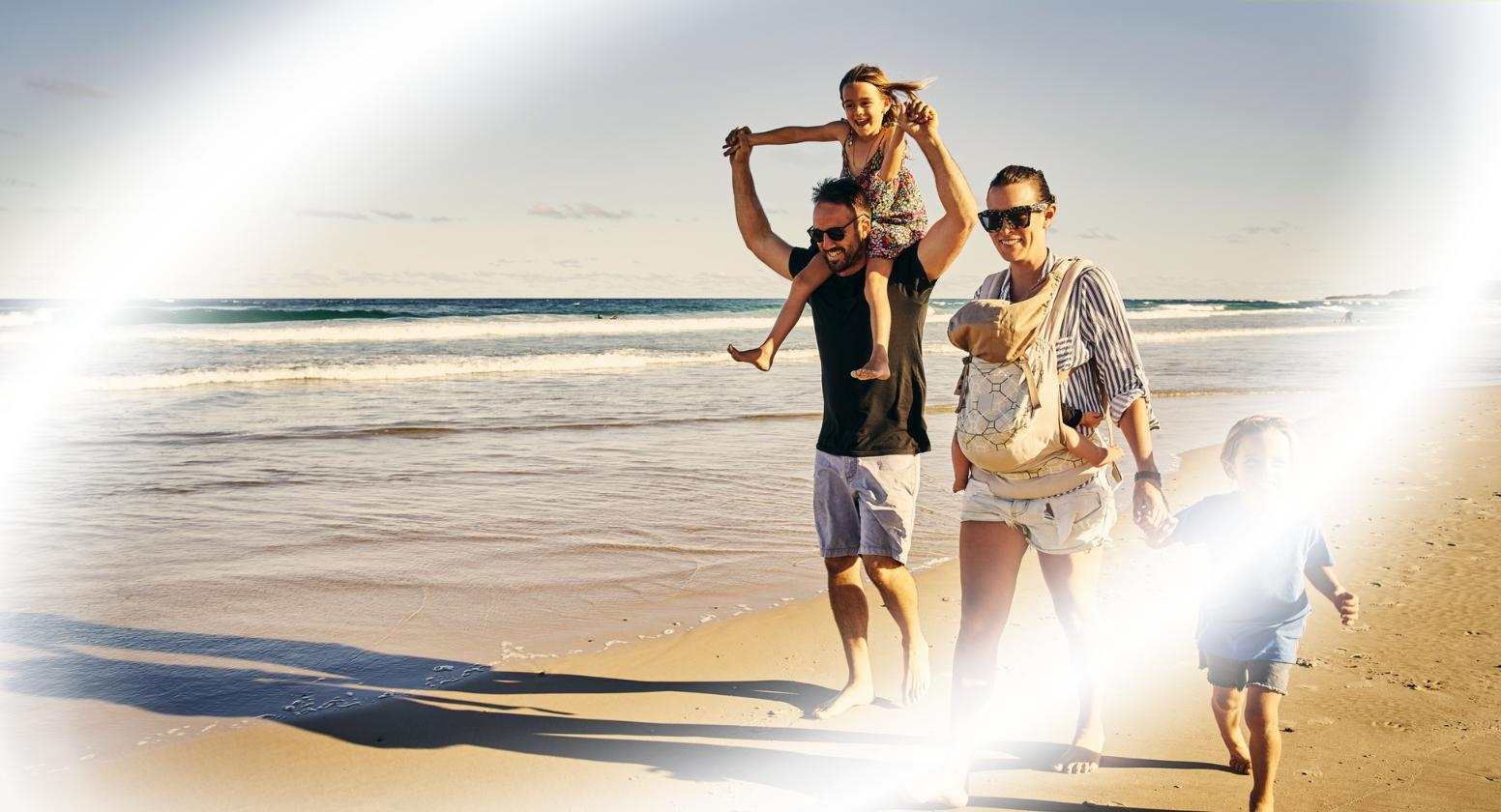 Glaucoma: Image of a happy family walking on the beach with blurred vision streaks sporadically across the scene. Glaucoma: Image of a happy family walking on the beach with blurred vision streaks sporadically across the scene.